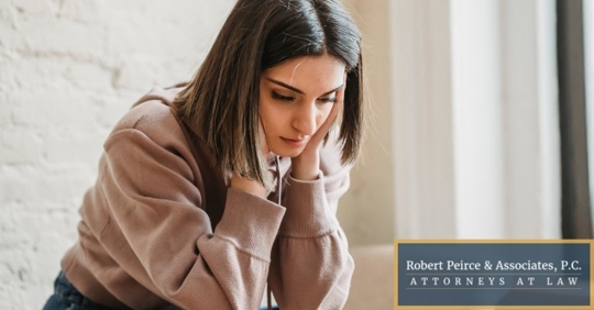 Woman holding her head